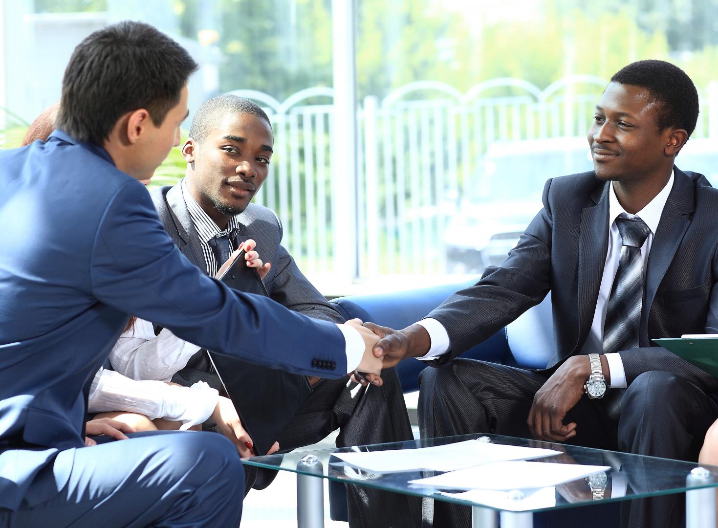 Three men in a meeting